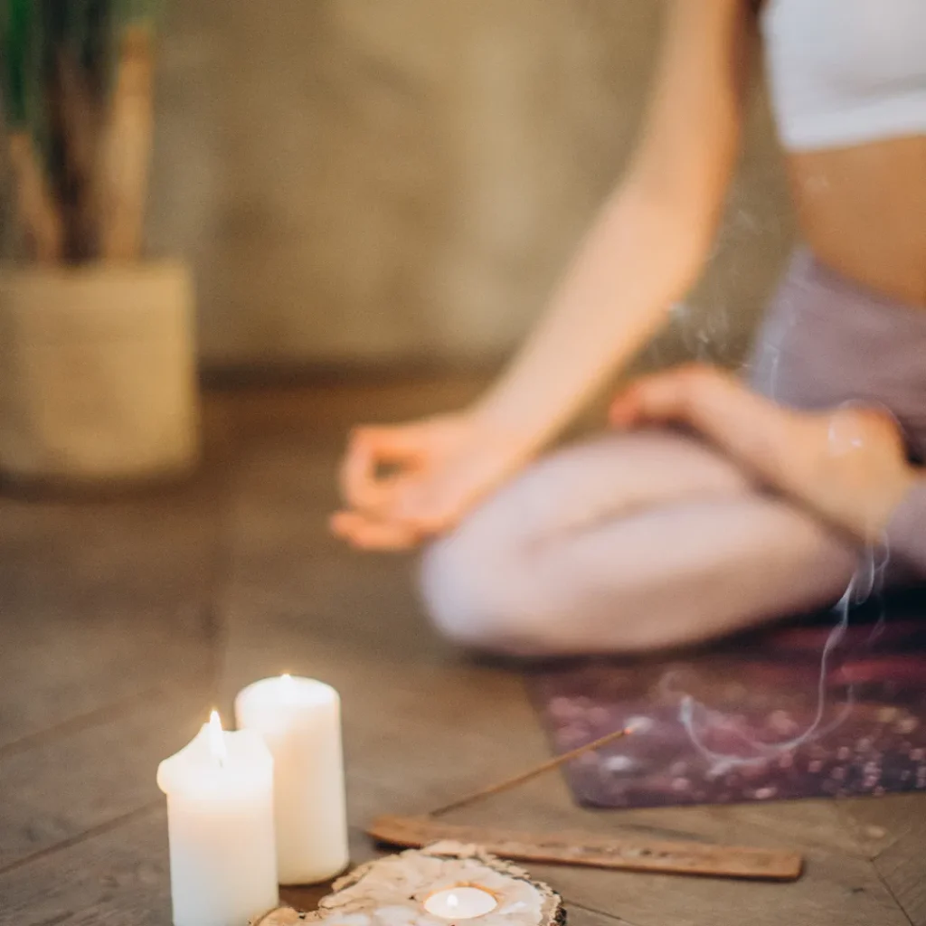 Yoga girl with candle