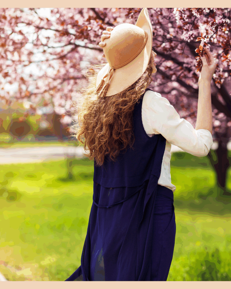 Woman smelling spring blossoms