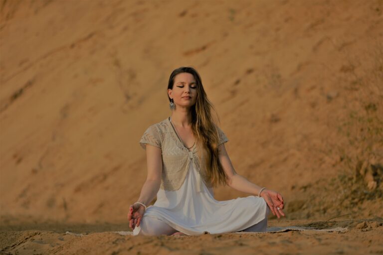 woman meditating in a natural setting, reconnecting with her true nature